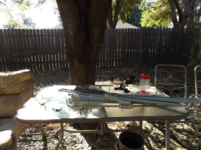 lot 941 image: Patio table  glass top rectangle   &  4 chairs (no cushions)