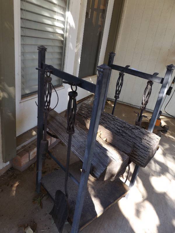 lot 943 image: Metal fireplace standWOOD RACK  and FIREPLACE TOOLS