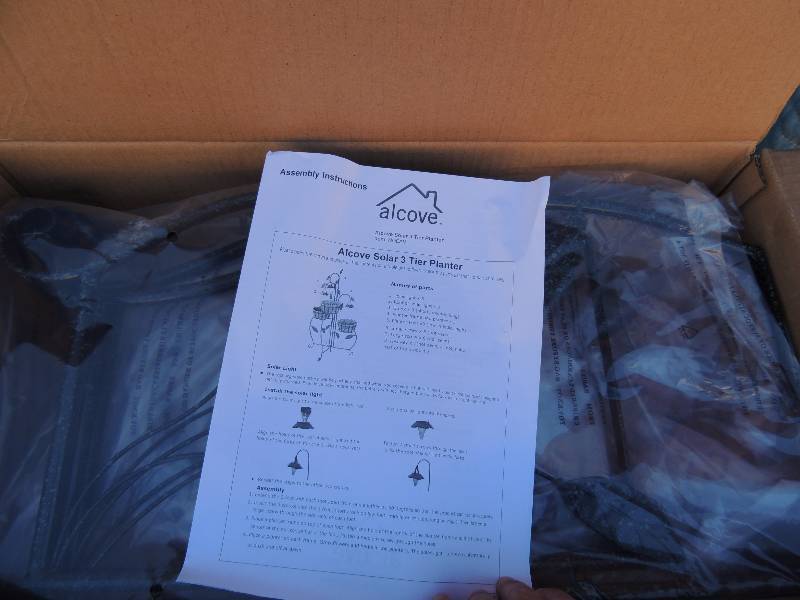 lot 863 image: AlcoveSOLAR  3 tier planter with stand NIB never opened, Black and brown pedestal 32 tall top 912.