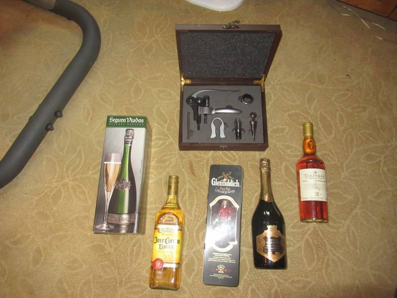 lot 38 image: FOR COLLECTIVE PURPOSES NO SEALS BROKEN 1 BOTTLE JOSE CUERVO, SEGURA VIUDAS, GLENFIDDICH SCOTCH WHISKEY IN TIN, TALISKER SCOTCH WHISKEY, BRUT ROCHE LACOUR AND 1 WINE OPENING KIT IN CASE BUYER MUST BE 21 YEARS OF AGE AND SHOW ID