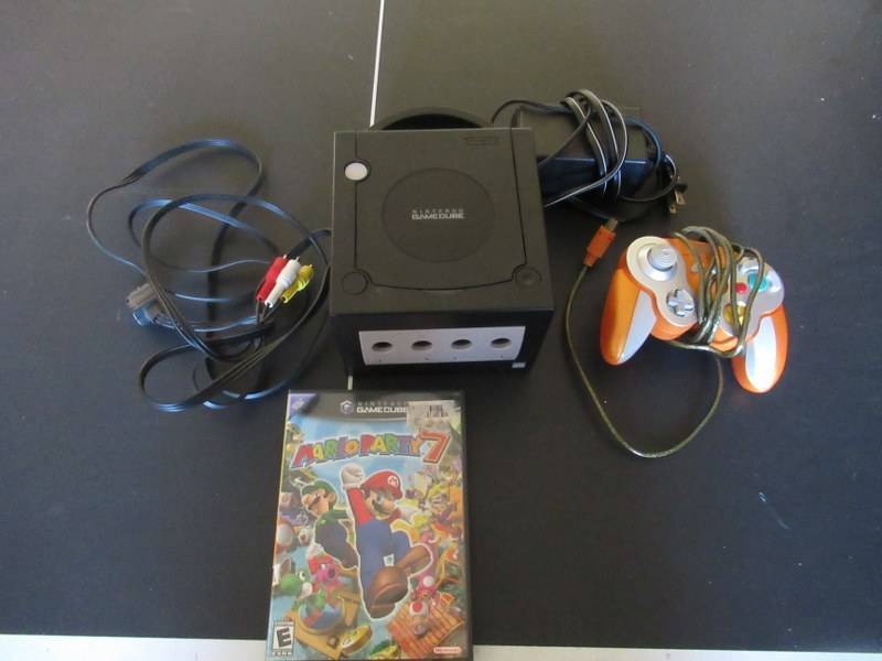 lot 52 image: NINTENDO  GAMECUBE MODEL# DOL-001 WITH ALL THE CORDS, CONTROLLER AND MARIO PARTY 7 GAME