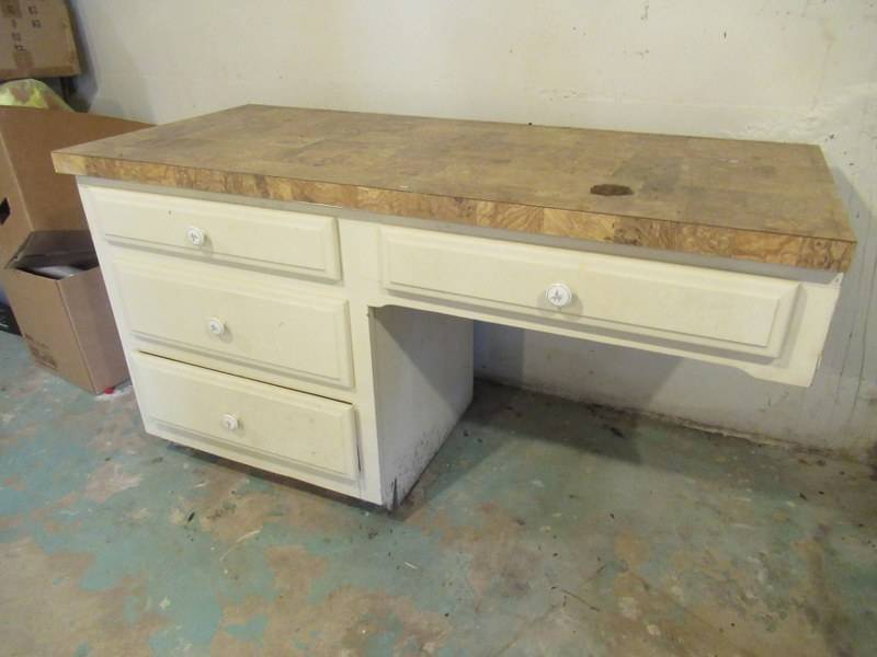 lot 62 image: FREE STANDING 4 DRAWER DESK MEASURES 55 X 23 X 31