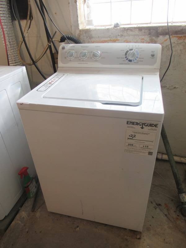 lot 67 image: GENERAL ELECTRIC WASHING MACHINE TOP LOADING MODEL# GTWN4250D WITH VARIABLE SPEED AND AUTO SENSING