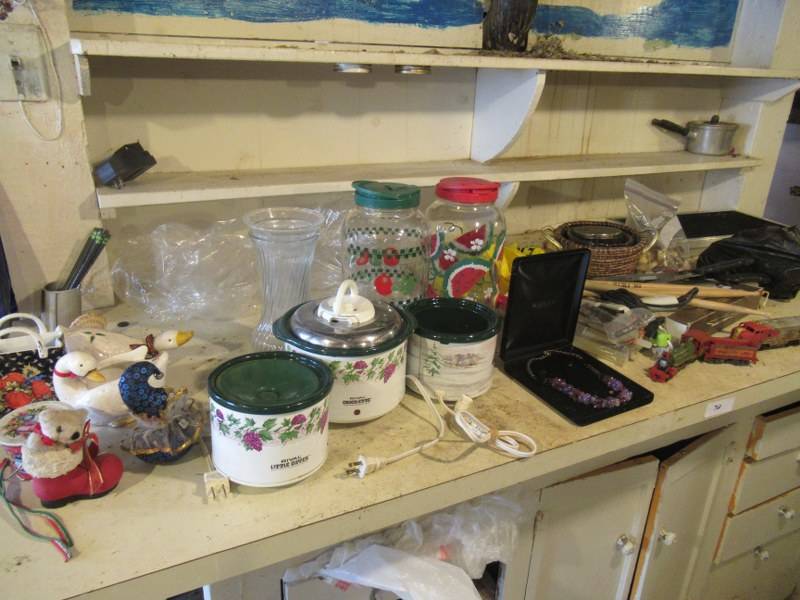 lot 72 image: CONTENTS OF SHELF INCLUDING 3 RIVAL LITTLE DIPPER ELECTRIC STONEWARE SERVER, DECANTERS, COSTUME JEWELRY, GLUE GUN AND STICKS, TOY TRAINS AND MORE