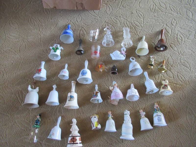 lot 165 image: BELL COLLECTION CERAMIC BELLS, WOOD BELLS, BELLS FROM ALL OVER THE WORLD OVER 50 BELLS ONLY HALF DISPLAYED