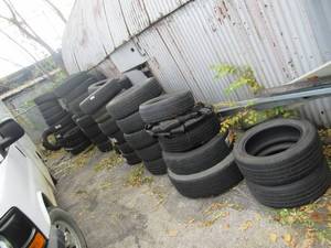 lot 18 image: LARGE ASSORTMENT OF USED TIRES SOME WITH GOOD TREAD SOME USED AND WORN