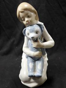 lot 143 image: NAO by Lladro Girl with Teddy Bear