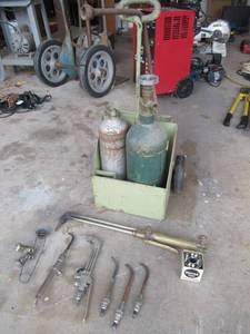 lot 12 image: WELDING BOTTLES AND CART WITH BRASS PUROX TORCH, SMITH TORCHES, VARIOUS TIPS AND MORE
