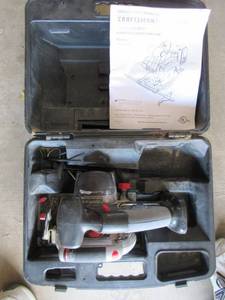 lot 21 image: CRAFTSMAN 5 12, 19.2 VOLT CORDLESS LASER TRIM SAW MODEL# 315.115160 WITH BATTERY AND CHARGER IN ORIGINAL CASE