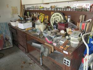 lot 38 image: WORK BRENCH WITH CONTENES THAT INCLUDE WILTON VISE, ZIRCON STUD SENSOR, DRAWERS FULL OF MISC., HAMMERS, DART BOARD, PAINT BRUSHES, NUTS, BOLTS,SCREWS AND MORE