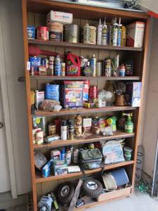 lot 42 image: CONTENTS OF ALL SHELVES INCLUDING DAP, MOTION DETECTOR, AUTOMOTIVE FLUIDS, HOUSEHOLD CLEANERS, STAINS, PAINTS, SMALL WHEELS AND MUCH MORE