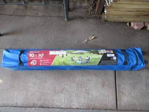 lot 59 image: QUEST 10 X 10 INSTANT UP CANOPY IN ROLL AROUND BAG UNUSED