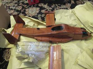 lot 95 image: WOODLAND CREATIONS V-22 OSPREY MAHOGANY MODEL HAND CRAFTED NEVER ASSEMBLED. BEAUTIFUL PIECE 16 LENGTH WINGSPAN 14