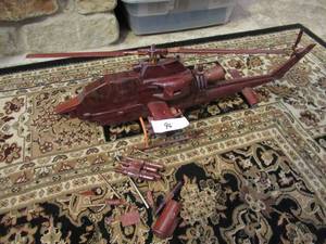 lot 96 image: WOODLAND CREATIONS UH-1 HUEY MAHOGANY MODEL HAND CRAFTED BEAUTIFUL PIECE SOME PIECES ARE IN BAG AND NEEDS REPAIR BUT YOU REALLY CANT TELL