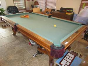 lot 114 image: SARATOGA GOLDEN WEST BILLIARDS CUSTOM MADE POOL TABLE MEASURES APPROX. 98 X 52 X 31 VERY ORNATE CARVINGS ON TABLE. IT WAS RECENTLY APPRAISED FOR $1200.00 TO $1500.00 T