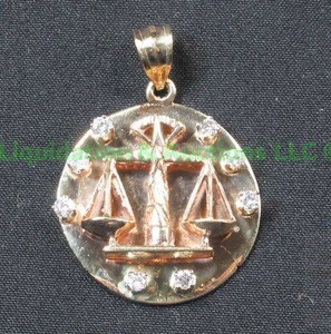 lot 14 image: 10K Gold, Diamond, Justice Symbol Pendant