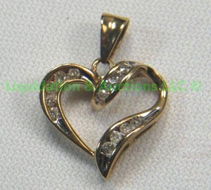 lot 89 image: 10K Gold, Diamond Heart Pendant