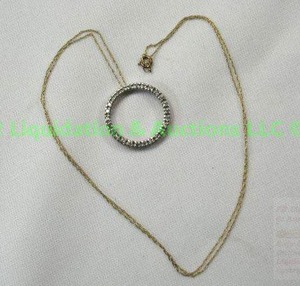 lot 153 image: 10K Gold, Diamond pendant