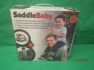 lot 98 image: THE ORIGINAL SADDLE BABY NEW IN BOX