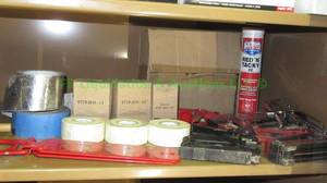 lot 120 image: Contents of shelf including staplers, tape, plus