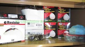 lot 121 image: Contents of shelf including Resistor ear plugs, SAS dust masks, safety glasses, plus