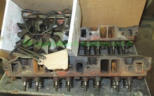 lot 132 image: Chevrolet 327 cid engine heads and parts, matches lot 99