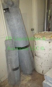lot 311 image: Metal Mesh fence netting and 55 gallon drum