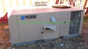 lot 407 image: York model DM060N10P4CAA1A forced air furnace with cooling system, exterior mount