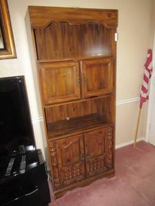 lot 11 image: SOLID WOOD BOOKCASECABINET WITH 2 SHELVES AND 2 STORAGE SPACES INCLUDES VARIOUS DVDS AND CDS 30 X 15 X 71