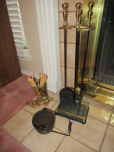 lot 18 image: FIREPLACE UTINSELS, BRASS BOOT MATCH HOLDER AND SMALL CAST IRON POT