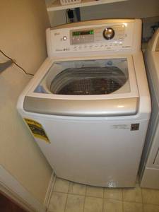 lot 31 image: LG WASHING MACHINE MODEL# WT5270CW INVERTER DIRECT DRIVE WITH TRUE BALANCE TOP LOADING WITH CLEAR DIAMOND GLASS LID. DUAL LED DISPLAY, STAINLESS STEEL DRUM