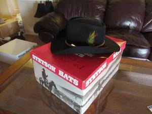lot 35 image: STETSON COWBOY BLACK FELT HAT WITH LEATHER BAND IN ORIGINAL HAT STORAGE BOX HAT SIZE 7 14