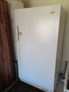lot 74 image: FRIGIDAIRE FREEZER MODEL# FFU16F9FW0 FROST PROOF WITH TEMPERATURE ALARM. BUYER MUST BRING BAG AND REMOVE ITEMS INSIDE. WORKING GREAT
