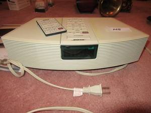 lot 145 image: BOSE WAVE RADIO MODEL# AWR1-1W WITH REMOTE AND PAPEWORK