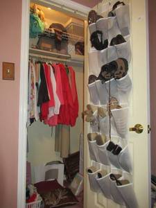 lot 173 image: CLOSET LOT INCLUDES HANGING SHOE HOLDER WITH WOMENS SIZE 6 SHOES, SIZE SMALL CLOTHING, PURSES AND MORE