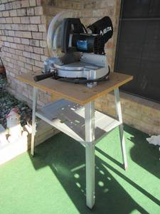 lot 182 image: DELTA 10 COMPOUND MITER SAW MODEL# 36-075 ON METAL STAND 24 X 20 31