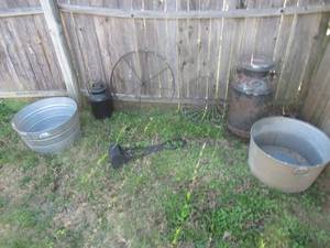 lot 190 image: 2 VINTAGE METAL MILK CANS, METAL WAGON WHEEL, WROUGHT IRON DESIGN, 2 TIN TROUGHS AND DOGGY POPPER SCOOPER