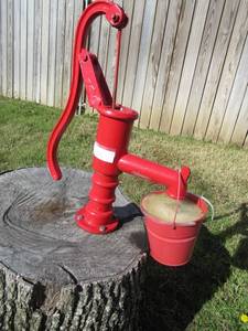 lot 199 image: CAST IRON WATER PUMP MOUNTED ON STUMP. BRING TOOLS TO REMOVE