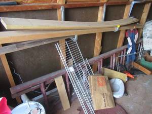 lot 212 image: CONTENTS OF SHED AS SHOWN WOOD LADDER, ADJUSTABLE ROLLER, TUBING, CRUTCHES, PIECES OF WOOD HANGING HOOKS, SANTA AND MORE