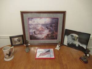 lot 51 image: AMERICAN EAGLE LOT INCLUDING FRAMED PRINT BY REICHADRT 27 X 23, STILL PHOTO OF EAGLE, EAGLE PLAQUE WITH SCRIPTURE, EAGLE CERAMIC MUG, AMERICAN FLAG PHOTO, AND 2 CERAMIC STATUES