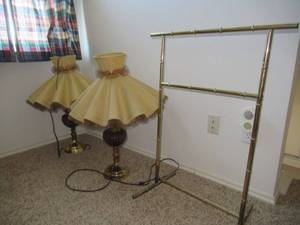 lot 71 image: RETRO TROPHY LAMPS BRASS FINISH AND CRIMSON GLASS GLOBES, 29 TALL AND BRASS FINISH THROWBLANKET HOLDER 34 TALL