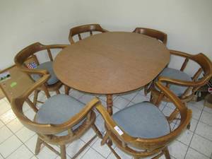 lot 85 image: WOOD DINING TABLE AND 6 ARMED WOOD CHAIRS WITH CUSHIONS