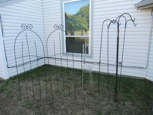 lot 94 image: 3 6 FT. SHEPARDS POLES, ROSE BUSH STABILIZERS AND WIND CHIME