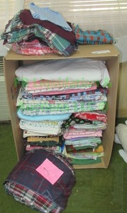 lot 22 image: Assorted sewing and quilting fabrics as shown