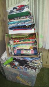 lot 27 image: Assorted sewing and quilting fabrics as shown