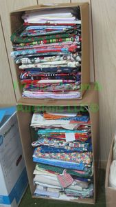 lot 32 image: Assorted sewing and quilting fabrics as shown