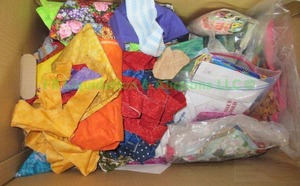 lot 33 image: Assorted sewing and quilting fabric remnants as shown