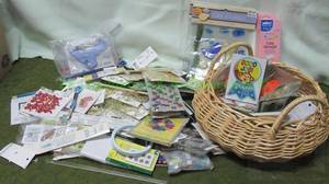 lot 67 image: Assortment of sewing supplies including buttons, trim, scissors, and more