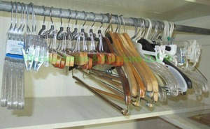 lot 207 image: Solid wood hangers plus new plastic hangers plus