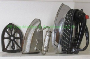 lot 302 image: Antique sad iron with hot plate and vintage cloth cord electric iron